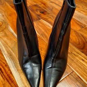 A pair of gently used ankle boots, all leather, size 8